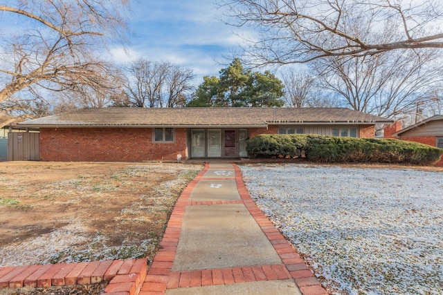 single story home with brick siding