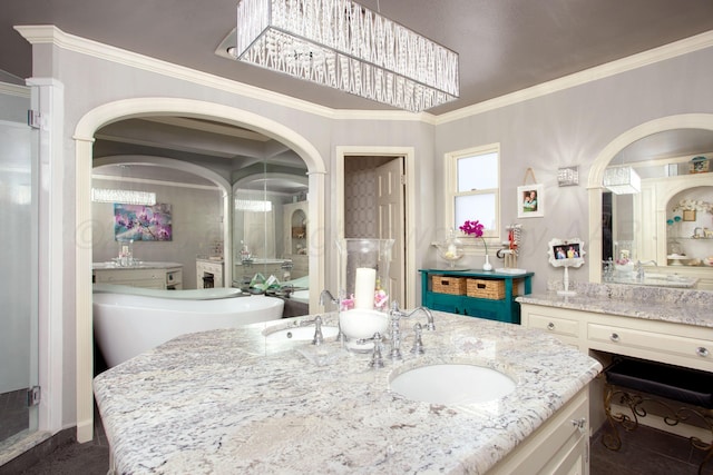 4214 Roxton Dr, Amarillo, TX 79109 - bathroom featuring vanity, crown molding, a freestanding tub, and a shower stall