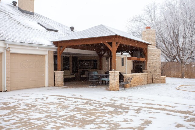 4214 Roxton Dr, Amarillo, TX 79109 - snow covered patio with a gazebo, a garage, and driveway