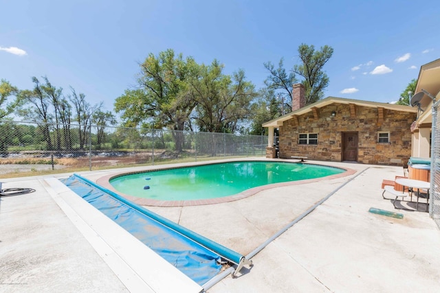 830 Burnett St, Miami, TX 79059 - view of pool with a fenced in pool, a storage structure, an outbuilding, fence, and a patio