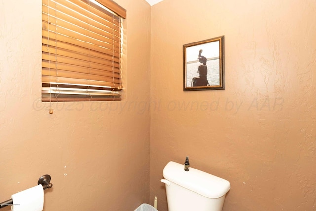 830 Burnett St, Miami, TX 79059 - bathroom with toilet and a textured wall