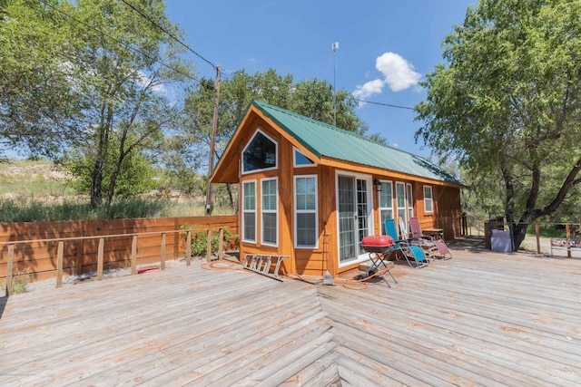 830 Burnett St, Miami, TX 79059 - wooden terrace featuring an outbuilding