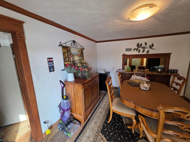 830 Burnett St, Miami, TX 79059 - dining area with visible vents and ornamental molding