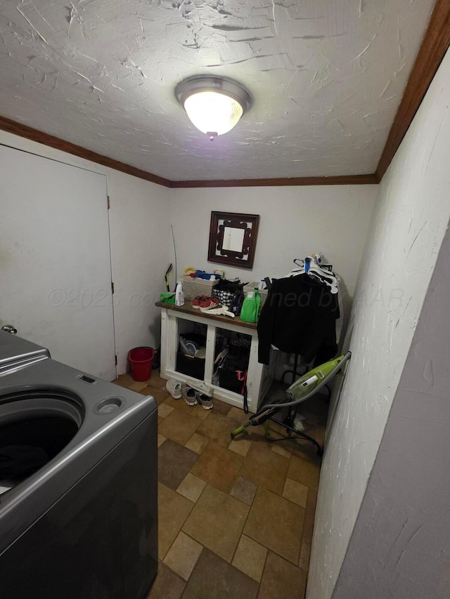 830 Burnett St, Miami, TX 79059 - clothes washing area featuring ornamental molding, stone finish flooring, and laundry area