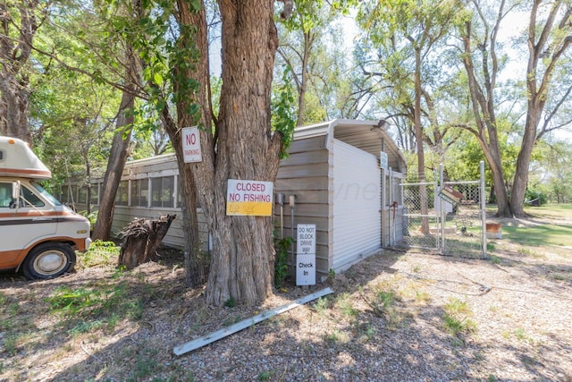830 Burnett St, Miami, TX 79059 - view of outdoor structure featuring a gate and fence