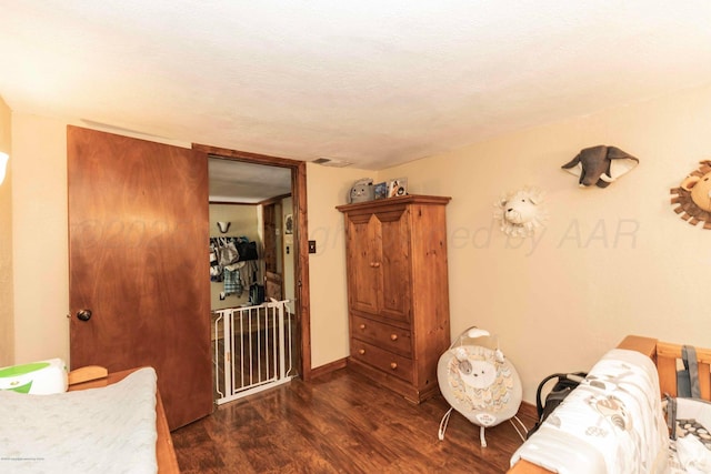 830 Burnett St, Miami, TX 79059 - interior space with a textured ceiling, baseboards, and wood finished floors