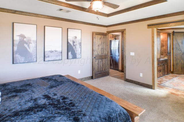 unfurnished bedroom featuring freestanding refrigerator, a raised ceiling, visible vents, and crown molding