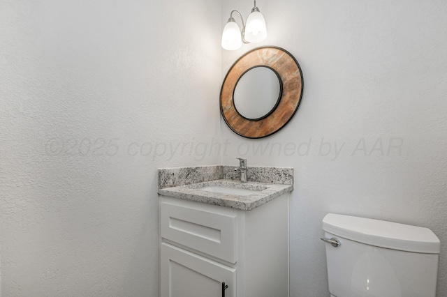 6011 Palmetto Trl, Amarillo, TX 79106 - half bath featuring vanity, toilet, and a chandelier