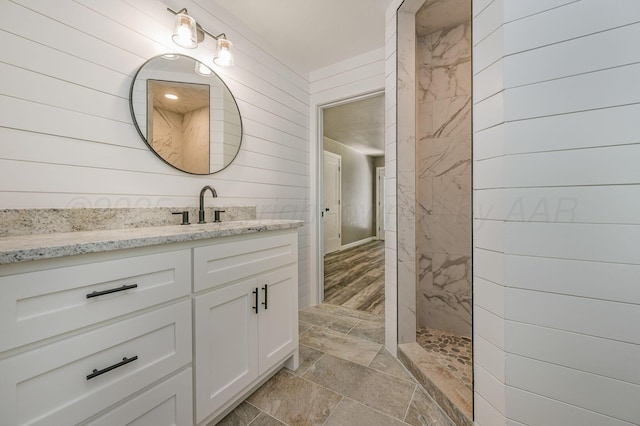 6011 Palmetto Trl, Amarillo, TX 79106 - full bath with vanity, wooden walls, and a walk in shower