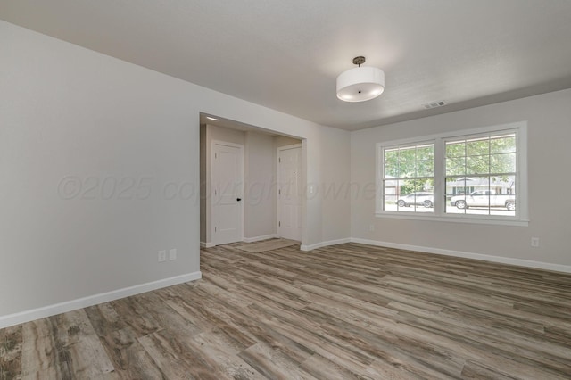 6011 Palmetto Trl, Amarillo, TX 79106 - spare room featuring wood finished floors and baseboards