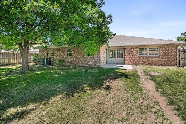 6011 Palmetto Trl, Amarillo, TX 79106 - back of property featuring brick siding, central AC unit, and a patio