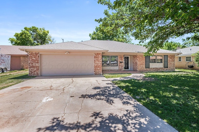6011 Palmetto Trl, Amarillo, TX 79106 - ranch-style house with a front yard, driveway, a garage, and brick siding