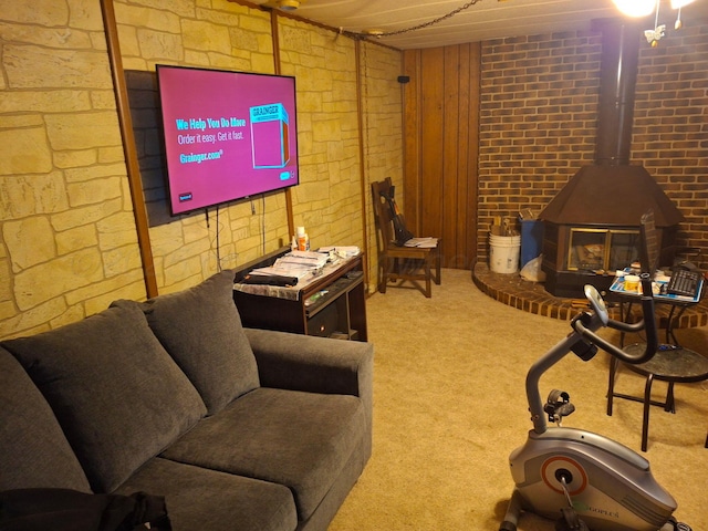 carpeted living room featuring a wood stove