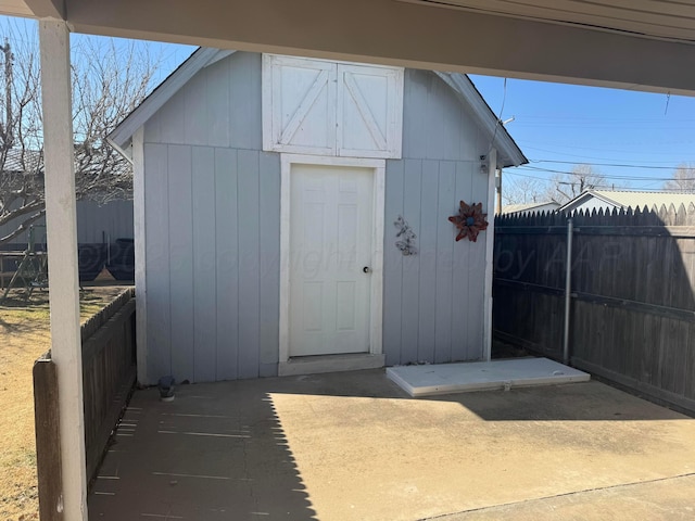 view of shed with fence