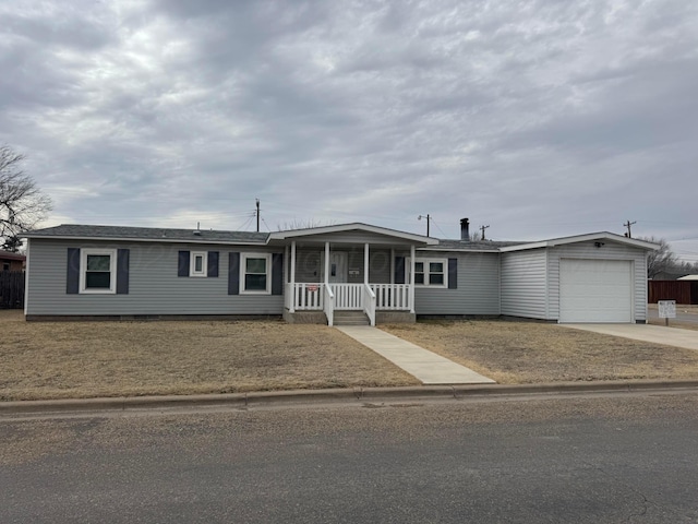 view of front of property with covered porch, driveway, and an attached garage