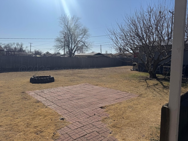 view of yard with a patio area and a fenced backyard