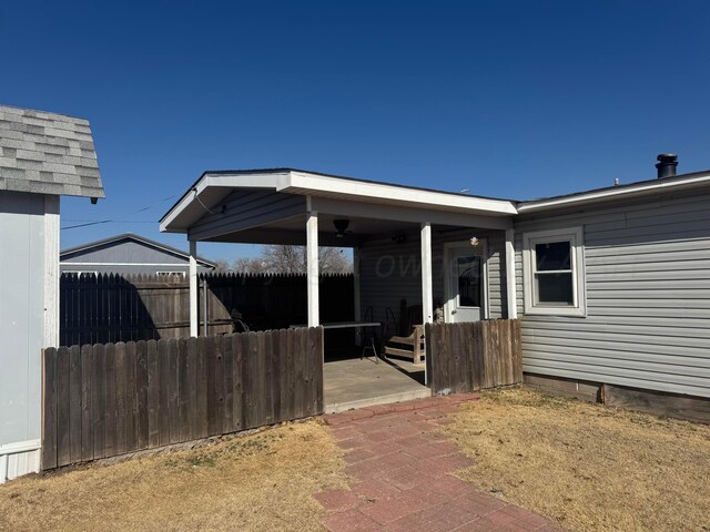 exterior space featuring crawl space, a patio area, and fence