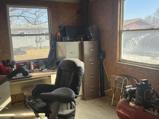 office with concrete flooring and plenty of natural light