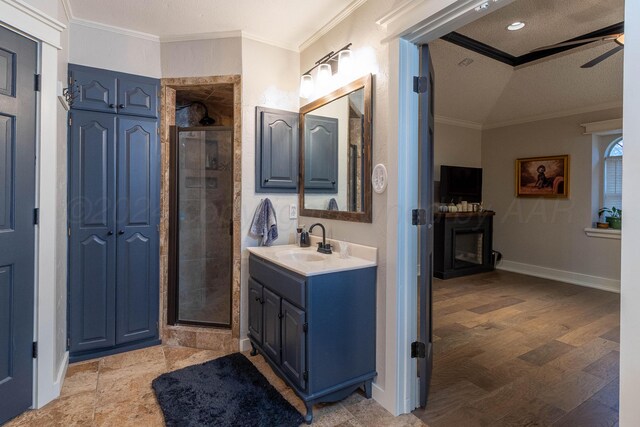 bathroom featuring walk in shower, wood-type flooring, and crown molding