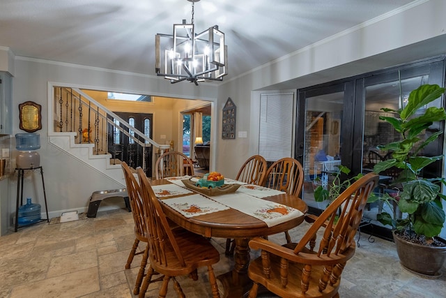 dining area with a chandelier and ornamental molding