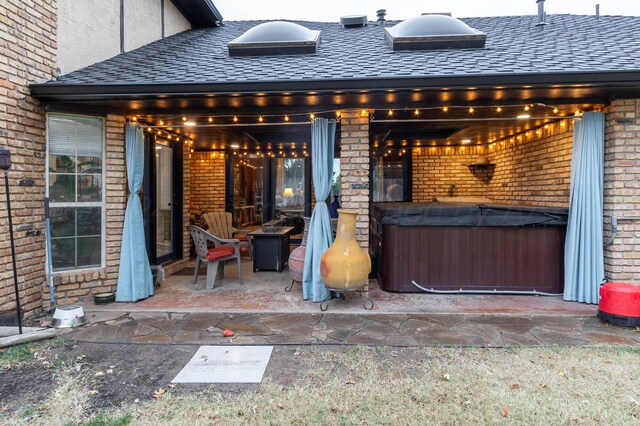 view of patio / terrace featuring a hot tub