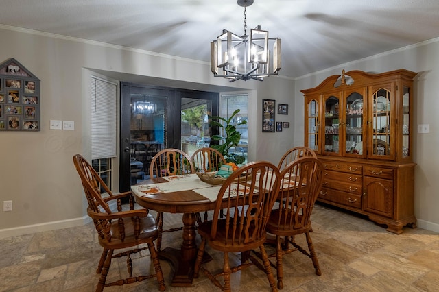 dining area featuring an inviting chandelier and crown molding