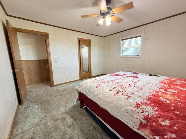 715 Ave P, Sunray, TX 79086 - bedroom with carpet flooring, crown molding, a textured ceiling, and a ceiling fan
