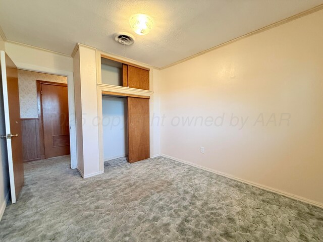 715 Ave P, Sunray, TX 79086 - unfurnished bedroom featuring carpet floors, a closet, and baseboards