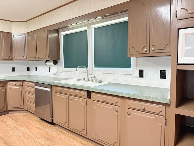 715 Ave P, Sunray, TX 79086 - kitchen with dishwasher, a sink, light wood-style flooring, ornamental molding, and white microwave