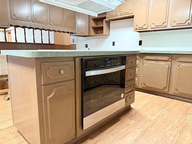 715 Ave P, Sunray, TX 79086 - kitchen featuring oven, light wood finished floors, open shelves, light countertops, and ventilation hood