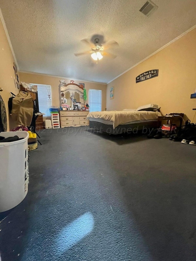 carpeted bedroom featuring multiple windows, a textured ceiling, ceiling fan, and crown molding