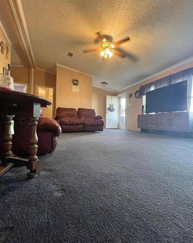 carpeted living room with a textured ceiling, ceiling fan, and crown molding