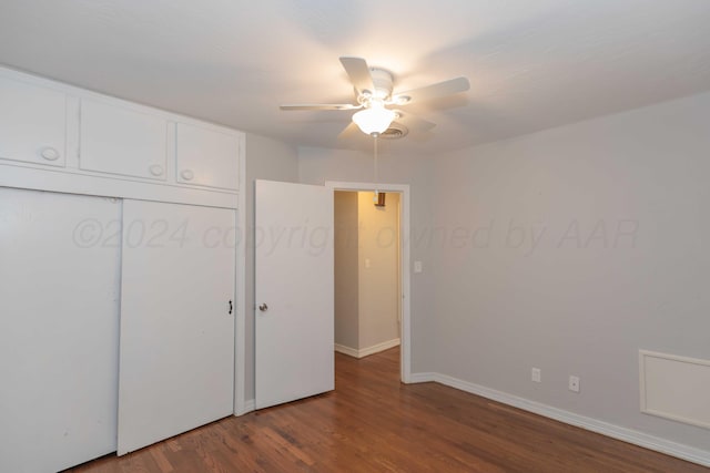 unfurnished bedroom featuring a closet, hardwood / wood-style flooring, and ceiling fan