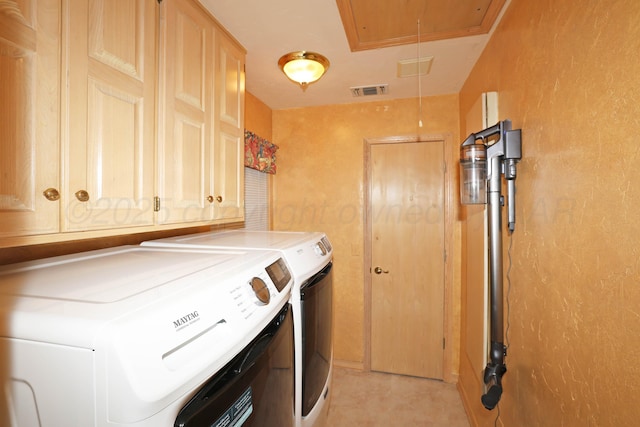 2604 Hawthorne Dr, Amarillo, TX 79109 - washroom featuring attic access, washer and dryer, cabinet space, and a textured wall
