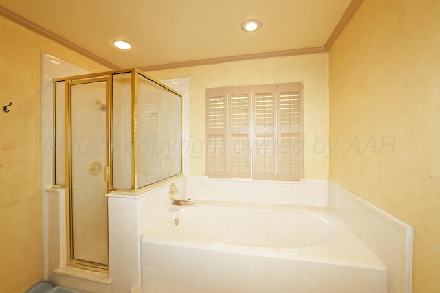 2604 Hawthorne Dr, Amarillo, TX 79109 - bathroom featuring a shower stall, a tub with jets, ornamental molding, and recessed lighting
