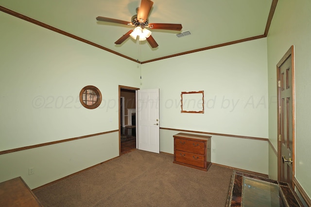 2604 Hawthorne Dr, Amarillo, TX 79109 - spare room featuring crown molding, a ceiling fan, and carpet