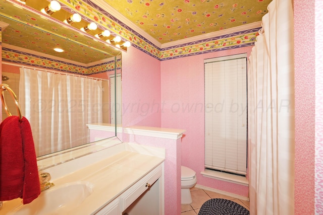 2604 Hawthorne Dr, Amarillo, TX 79109 - full bathroom featuring toilet, vanity, tile patterned floors, and crown molding