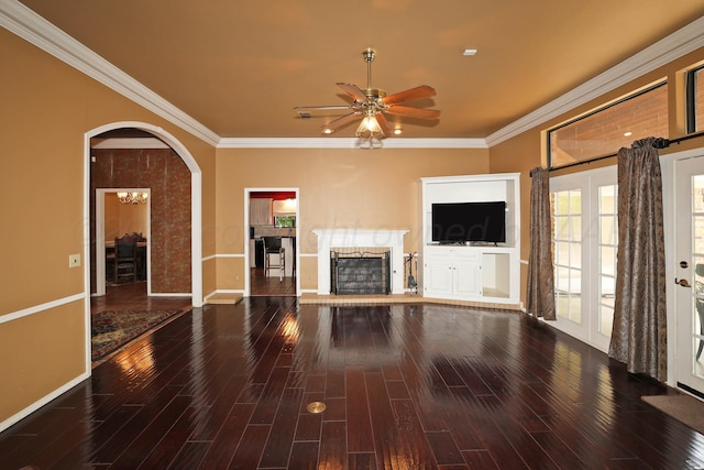 2604 Hawthorne Dr, Amarillo, TX 79109 - unfurnished living room featuring ceiling fan, wood finished floors, baseboards, ornamental molding, and a fireplace with raised hearth