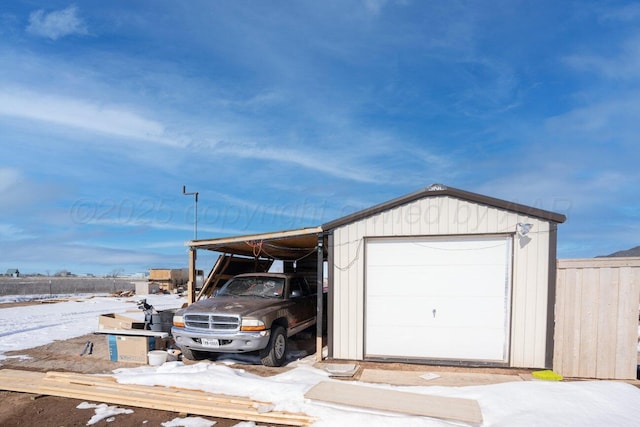 view of snow covered garage