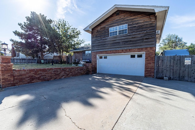 view of property exterior featuring a garage