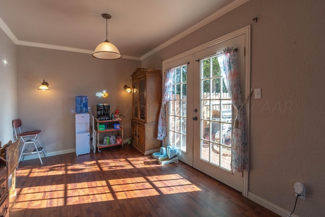 entryway featuring dark wood-type flooring, french doors, and crown molding