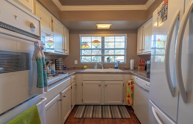 kitchen featuring ornamental molding, white cabinetry, dark hardwood / wood-style flooring, sink, and white appliances