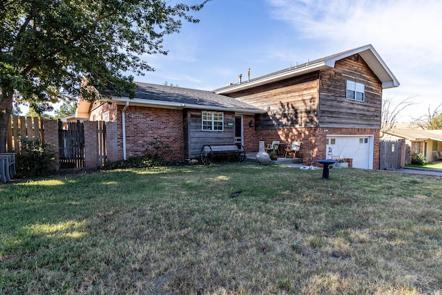 view of front facade with a garage and a front lawn