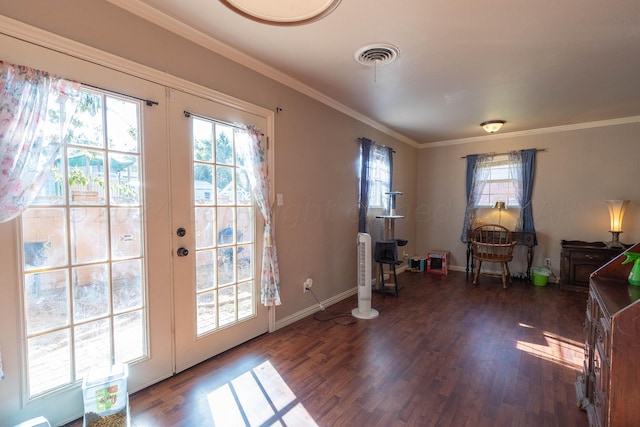 doorway with ornamental molding and dark hardwood / wood-style floors