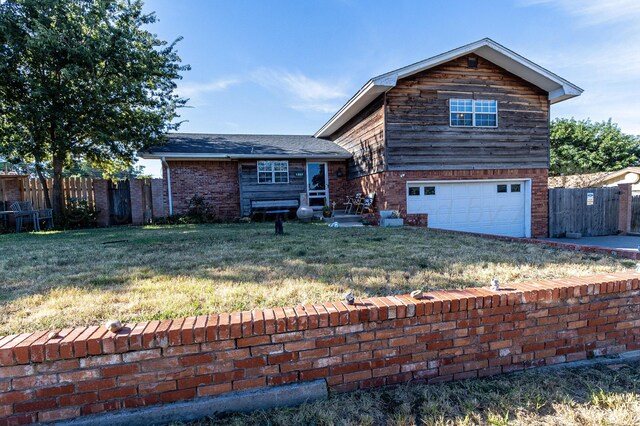 view of front of house with a garage and a front yard