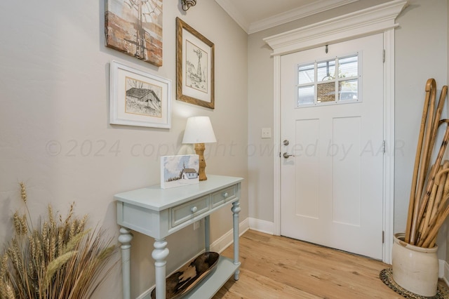 entrance foyer featuring light hardwood / wood-style floors and crown molding