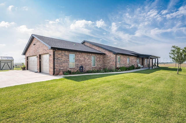 view of side of property with a lawn and a garage