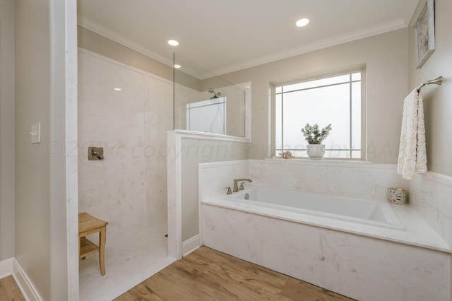 bathroom featuring crown molding, hardwood / wood-style floors, and independent shower and bath