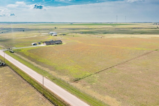 birds eye view of property featuring a rural view