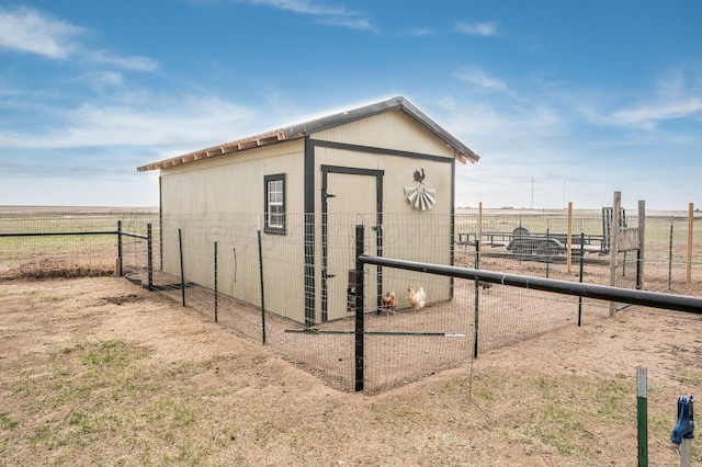 view of outdoor structure featuring a rural view